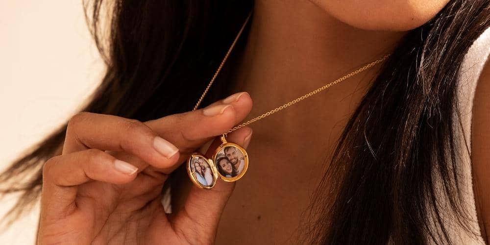 woman wearing a personalized locket with a picture of her and her partner inside.