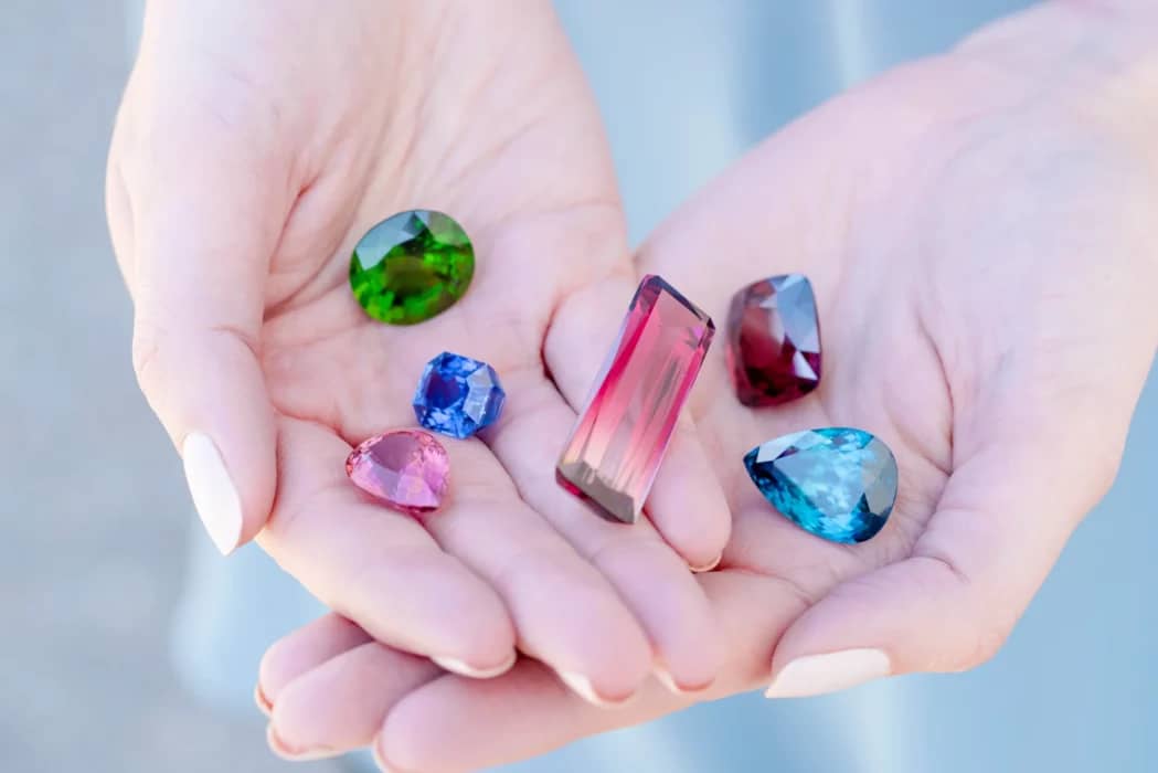 hand holding a polished gemstone