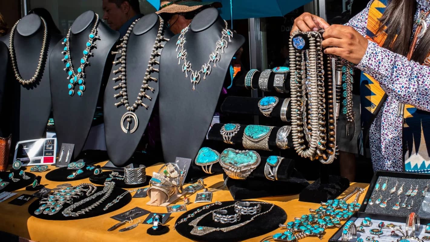 A display of Native American jewelry at a market