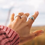 women wearing rings in all the fingres of her hand