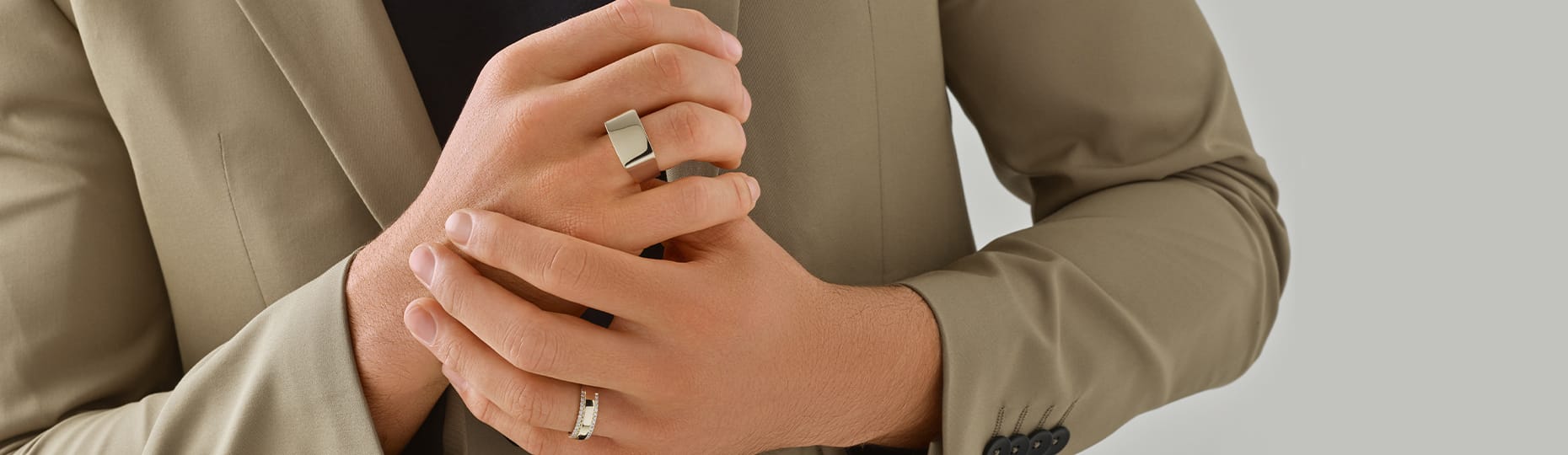 man wearing rings in both hands