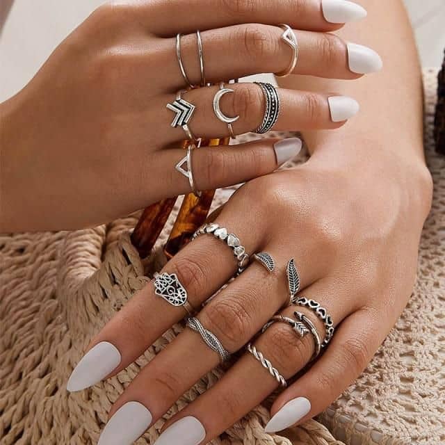 woman wearing multiple rings of different sizes