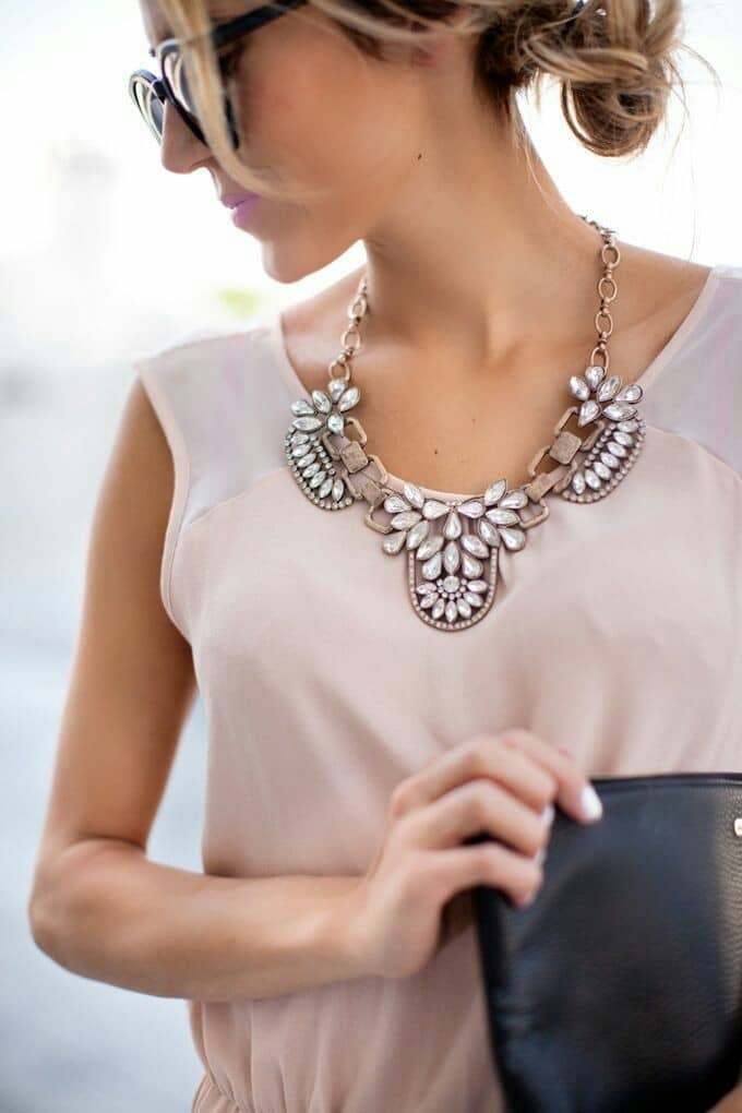 woman wearing statement necklace 