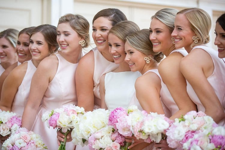 bridesmaids wearing jewelry that complements their dresses and the overall wedding theme.