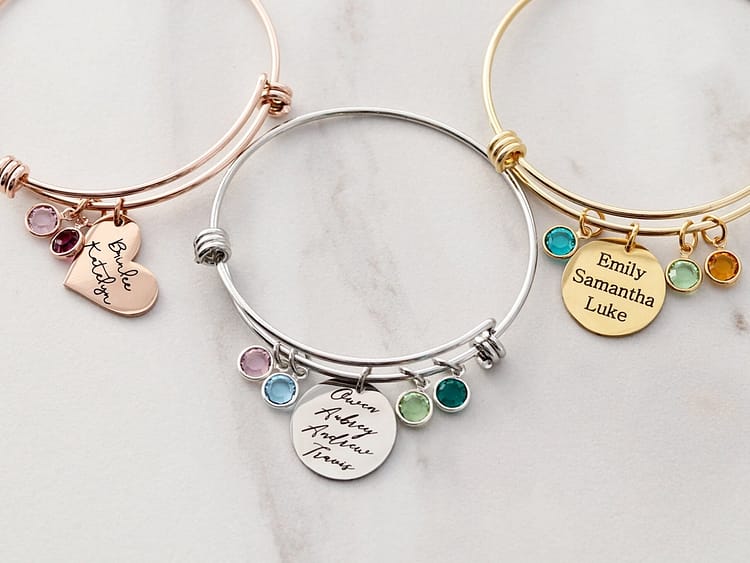 Personalized charm bracelet with birthstones and engraved names