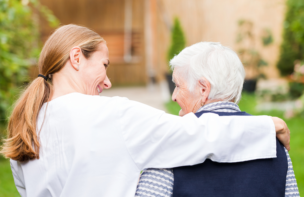 A caregiver providing emotional and psychological support to a senior