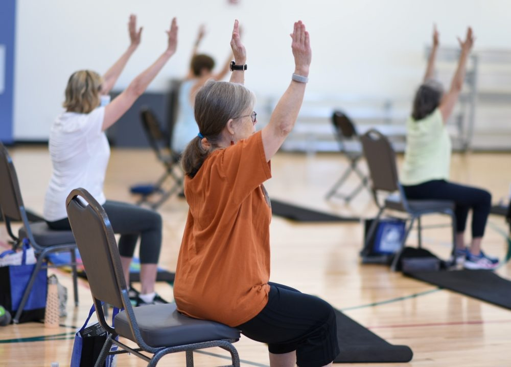 Seniors participating in a group exercise class