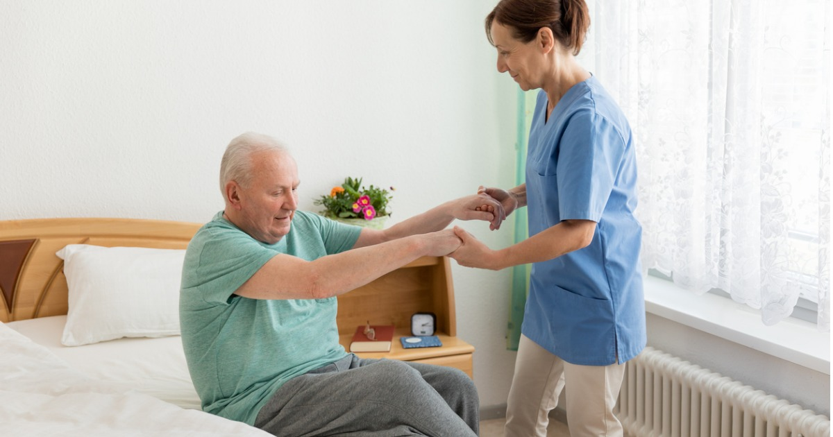 caregiver helping elderly