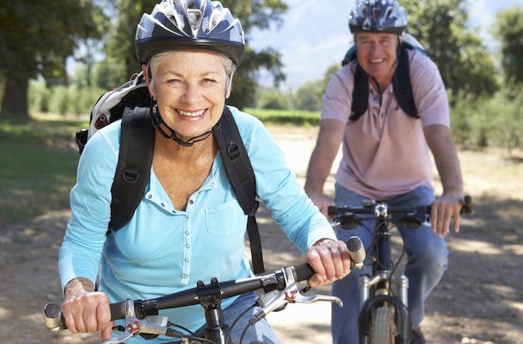 elderly woman and man on bi-cycle