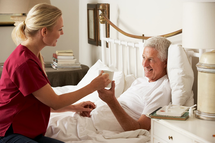Caregiver assisting patient with daily tasks