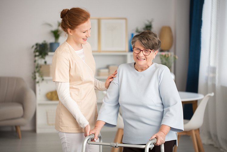 A healthcare professional consulting with an elderly patient about mobility aids.