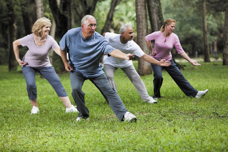 Elderly people practicing yoga and Tai Chi