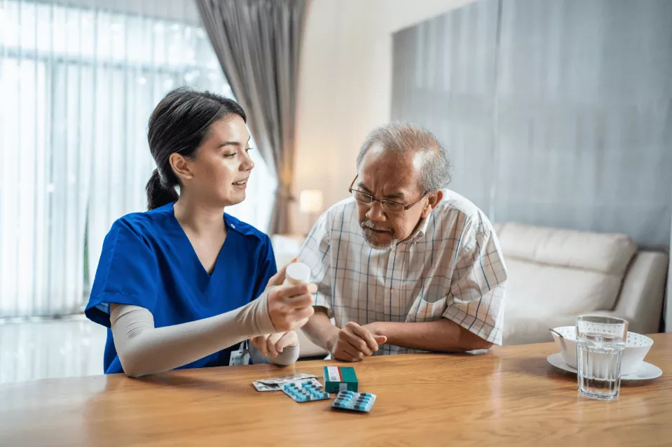 A physician reviewing a medication regimen with a senior patient.
